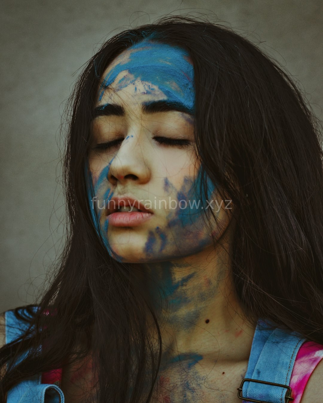 Child with colorful face paint