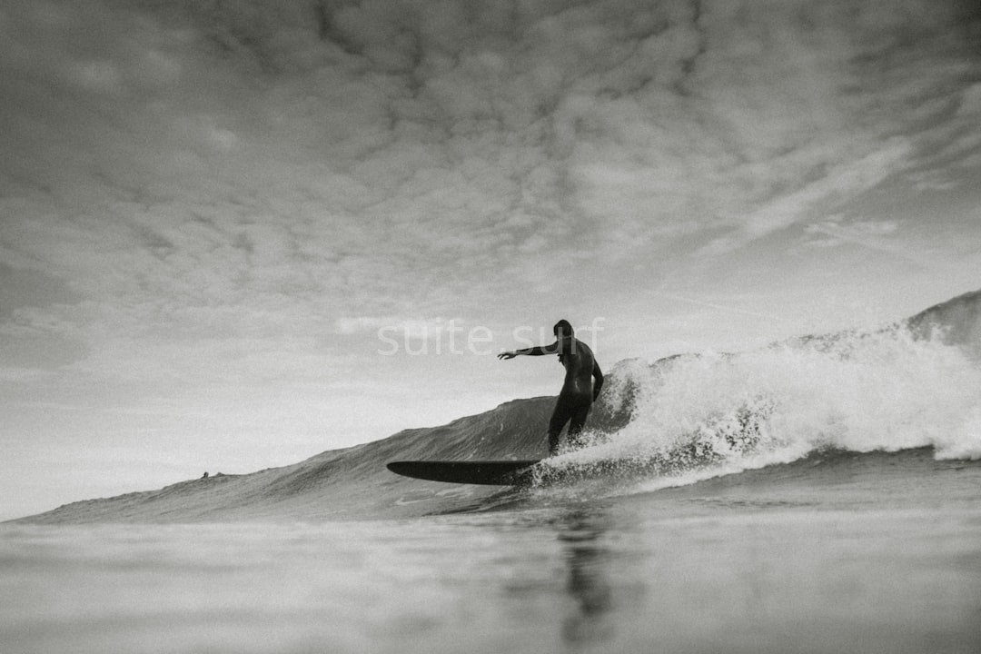 Surfer catching wave